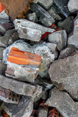 Pile of broken concrete and brick debris in construction site