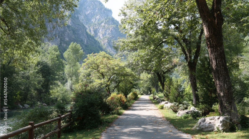 Poster serene walking path by the river surrounded by lush greenery and mountains in a peaceful setting