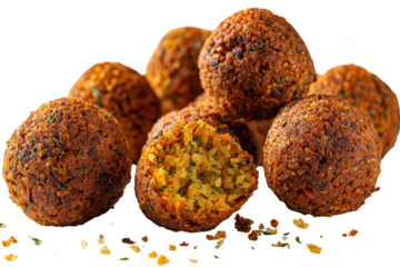 A close up view of several fried balls with one cut open on a transparent background showing the inside