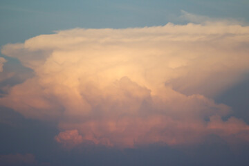 Heavenly Canvas: Capturing the breathtaking formation of cloudscape illuminated by the fading...