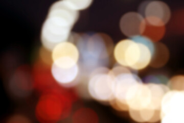 Abstract Night Lights: A mesmerizing collection of blurred orbs of golden and white light dances against a dark backdrop, creating a dreamy.