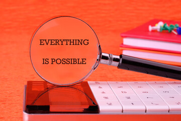 Business anything possible concept. Copy space. Text EVERYTHING IS POSSIBLE focused through a...