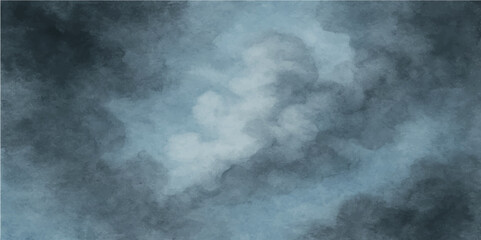 Dark stormy blue sky with ominous clouds and a hint of light