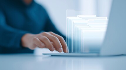 Digital workspace with a person using a laptop, interacting with virtual file folders, showcasing modern technology and efficient data management in a professional environment