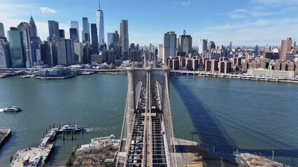 Obraz premium Brooklyn Bridge At Manhattan In New York United States. Highrise Buildings Scenery. Manhattan Bridge Landscape. Brooklyn Bridge At New York United States. Downtown Cityscape. 