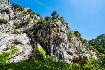 Sheer limestone cliff in Agali Gorge sunlight