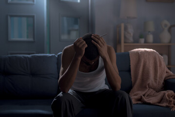 Young bearded male handles depression episode at home