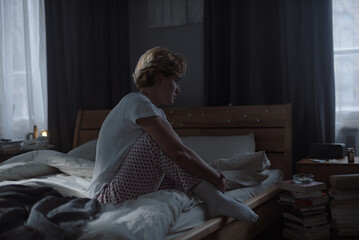 Stressed female with depression disorder in dark room