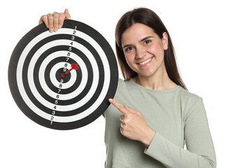Targeting. Smiling woman pointing at dart board with arrow on white background