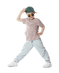 Happy little boy in sunglasses and baseball hat dancing on white background