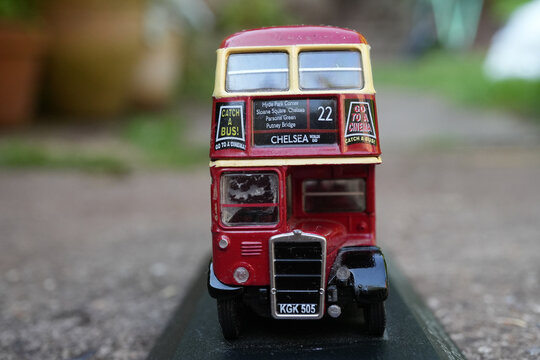 Nottingham, Nottinghamshire, England &ndash; June 18 2025: Close-up view of a classic red double-decker London bus model with route 22 to Chelsea, nostalgic cinema advertisements, and license plate KGK 505.