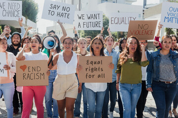 Latin people protesting on streets for Human Rights and stop racism in Mexico Latin America. Group...