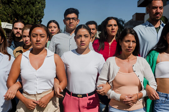 Group of Latin people activists protesting on streets for Human Rights in Mexico Latin America, Hispanic women and men together for peace and equality - Powered by Adobe
