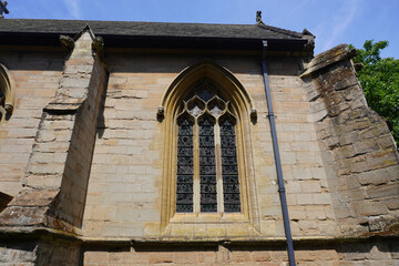 Nottingham, Nottinghamshire, England - June 18 2025: Stone building facade with Gothic arched...