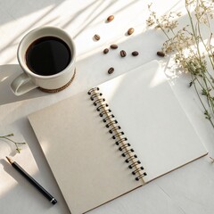 Blank Spiral Notebook Mockup with Coffee Mug and Seeds on White Desk 