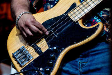 Unrecognizable musician playing electric guitar on a summer music festival