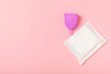Menstrual cup on a bright background. Sanitary napkins, tampons and menstrual cup.Concept of...
