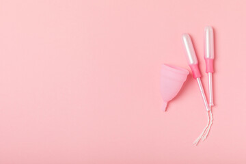 Menstrual cup on a bright background. Sanitary napkins, tampons and menstrual cup.Concept of...