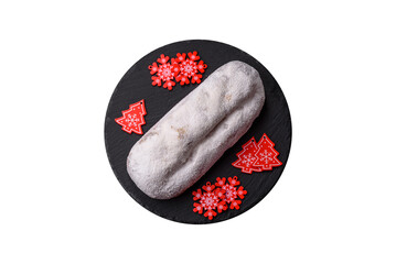 Christmas Stollen, a German sweet cake with marzipan and fruit. Winter Christmas Stollen