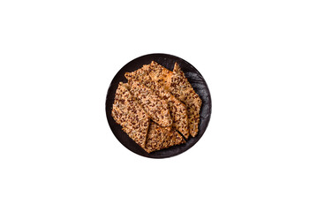 Crispbread, thin bread with seeds and grains, a baked cracker. Crispbread with sesame seeds