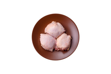 Meat, raw chicken thigh, leg in skin with salt and spices. Raw chicken thigh