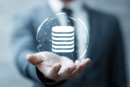 Businessman holding digital database icon