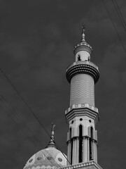 low key shot of a mosque dome and the minaret