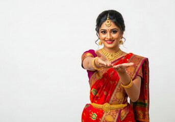 Beautiful Indian Woman in Red Saree Offering Gift or Presenting Product