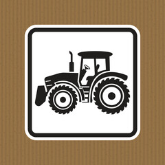 Black and White Icon of a Tractor on a Textured Cardboard Background