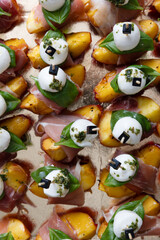 Peaches with mozzarella, prosciutto and basil
