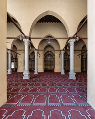 Al-Zahir Baybars Mosque, a testament to Egypt's profound Islamic heritage, is characterized by its towering columns, arched passages, and intricately decorated prayer carpet
