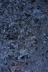 A close up of a blue and white background with ice crystals