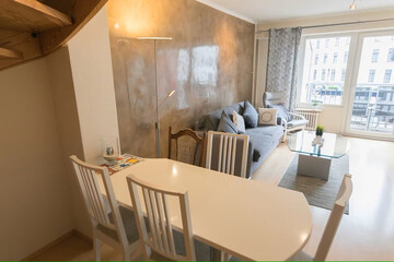 Modern living room interior with kitchen