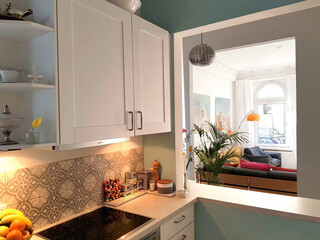 Modern living room interior with kitchen