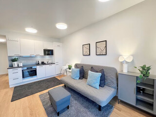 Modern living room interior with kitchen, blue color