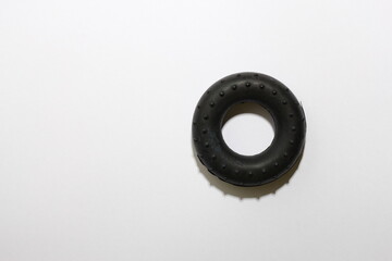 Rubber hand gripper for strengthening hand and finger muscles. Grip training, rehabilitation, sports