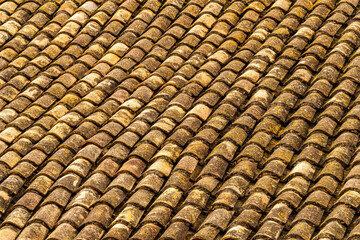 orange and brown old tile roof texture background. Old vintage roof tiles backdrop for concept and design.