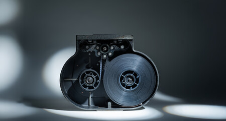 35mm movie camera cassette for background.vintage 35mm professional movie camera cassette with film...