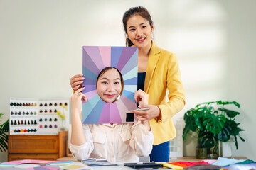Obraz premium Personal Color Analysis Consultation with Young Women Discovering Best Palette for Wardrobe Style Choosing Seasonal Tones for Flattering Look