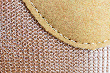 Image shows a close-up of textured fabric or material with an intricate pattern, possibly used for...
