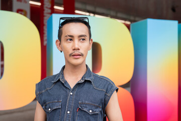 Portrait of confident non binary gay man during pride outdoors