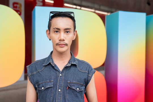 Portrait of confident non binary gay man during pride outdoors