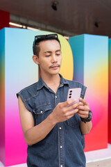 Portrait of confident non binary gay man during pride outdoors