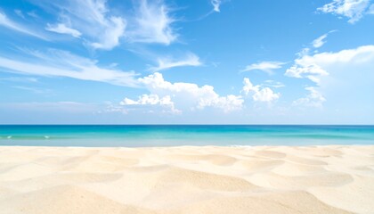 Obraz premium Pristine Sandy Beach with Turquoise Ocean and Pastel Blue Sky
