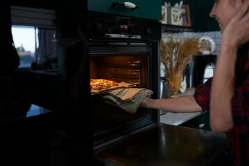 making homemade pizza at home in the kitchen