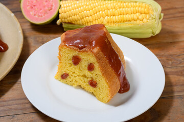 Delicious slice of Brazilian corn cake with guava and corn on the cob