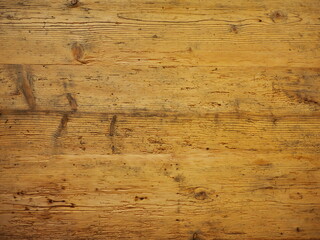 A wooden surface with a grainy texture