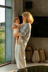 Hirtshals, Denmark A six-month old baby girl is held by her grandma.