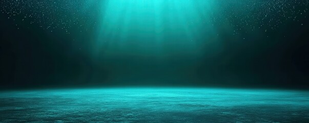 Fototapeta premium An underwater scene with light rays penetrating the ocean depths, illuminating the marine environment with a blue-green glow and suspended particles.