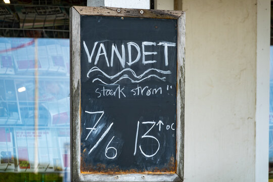 Hirtshals, Denmark A blackboard on a North Sea beach says water temperature is 13 degrees Celsius in Danish.
